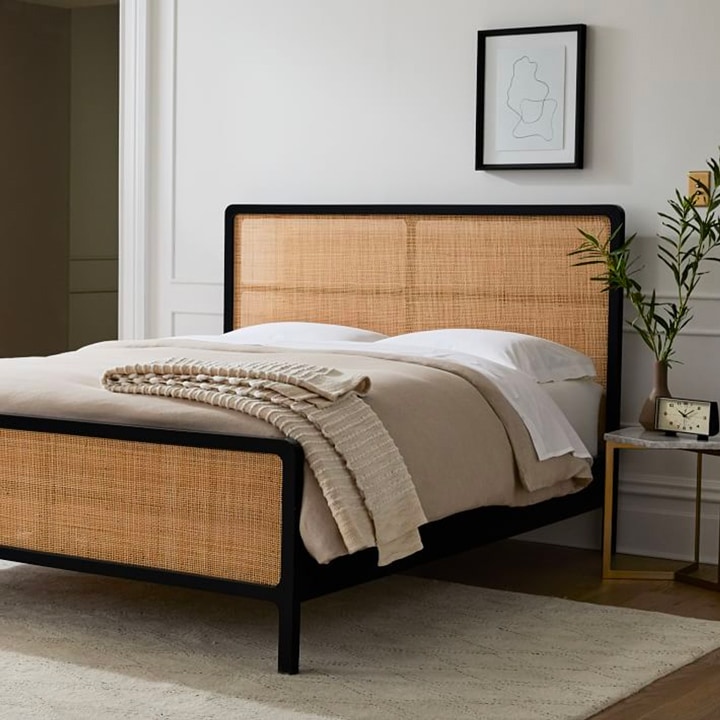 Modern bed with woven cane headboard