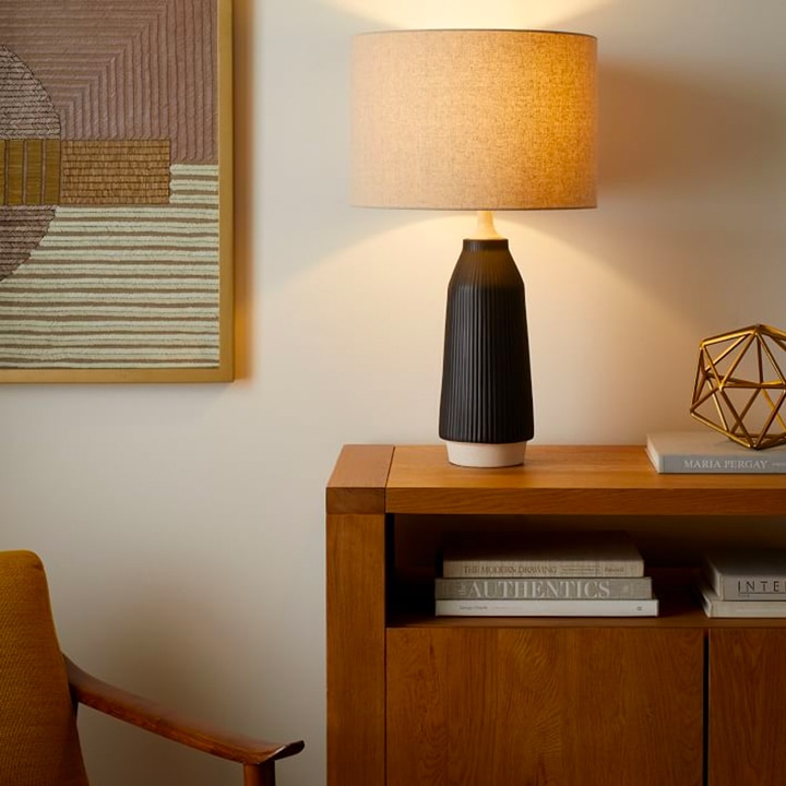 Black table lamp on wooden console