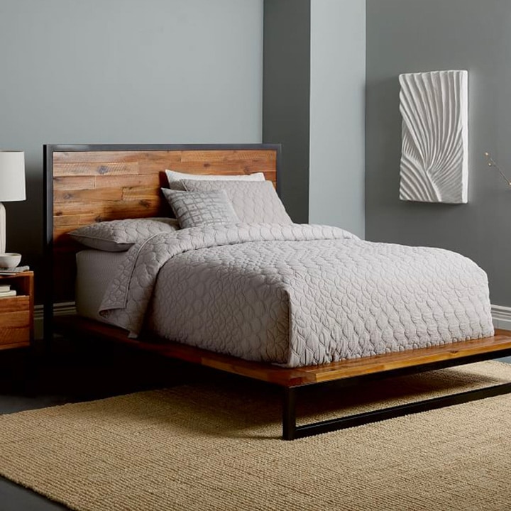  Industrial wooden bed platform with gray bedding