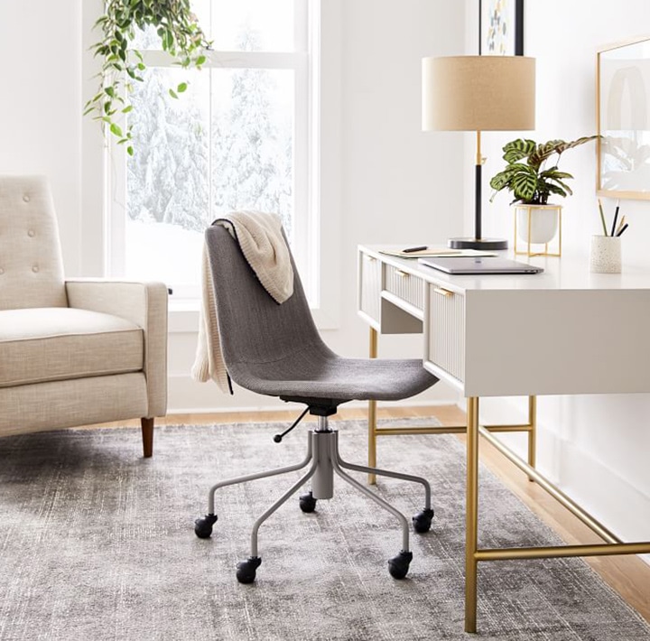Modern desk with gold legs and gray chair