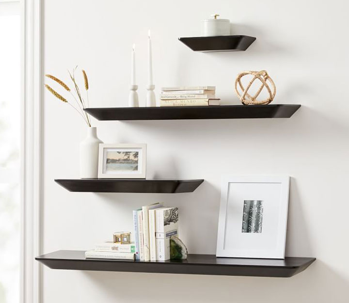 Slim floating black shelves with decor