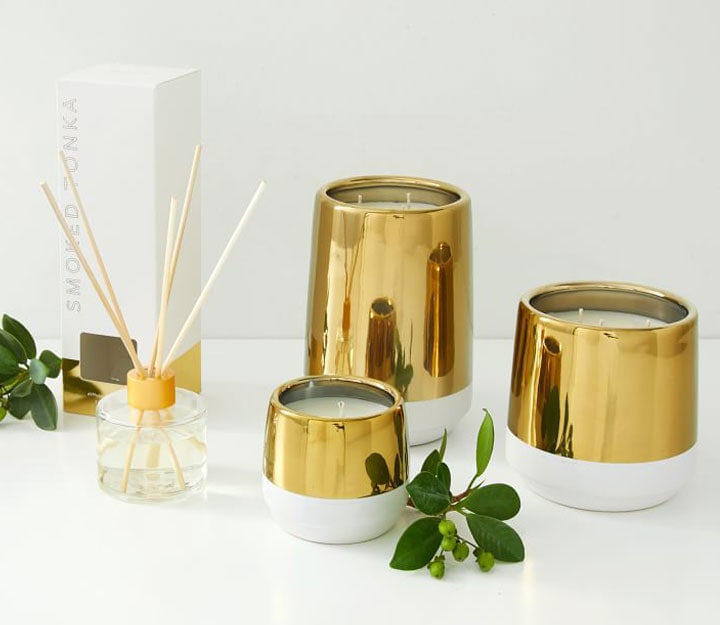 White and gold scented candles with incense