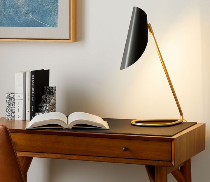 Modern curled shade lamp on a desk