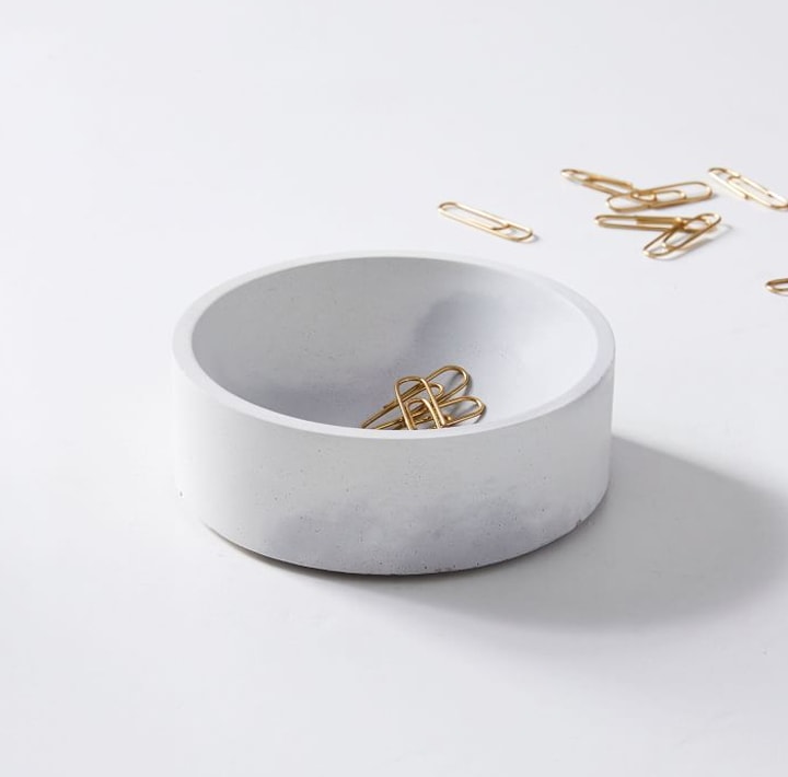 Gray dish with gold paperclips