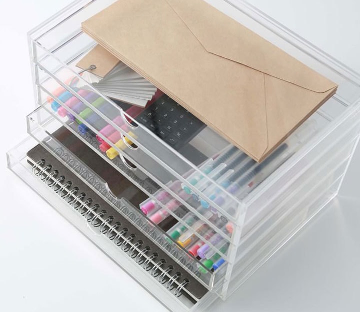 Acrylic storage drawers filled with supplies
