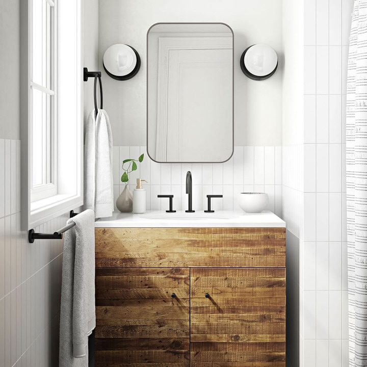 Bathroom with single vanity made of reclaimed wood.
