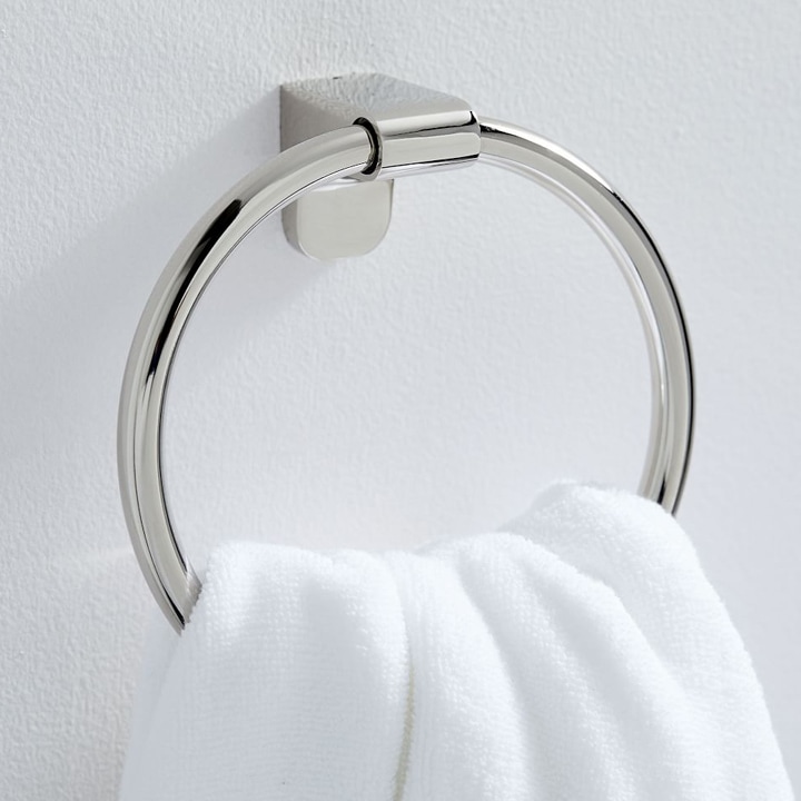Chrome towel hoop holding towel.