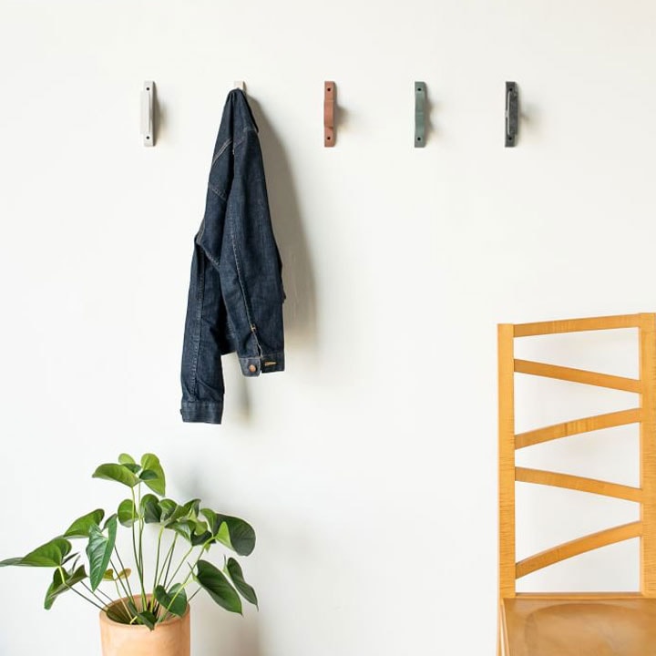 Five colored wall hooks.