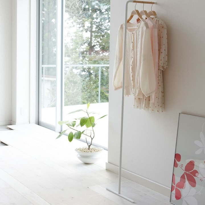 Freestanding white clothes rack.