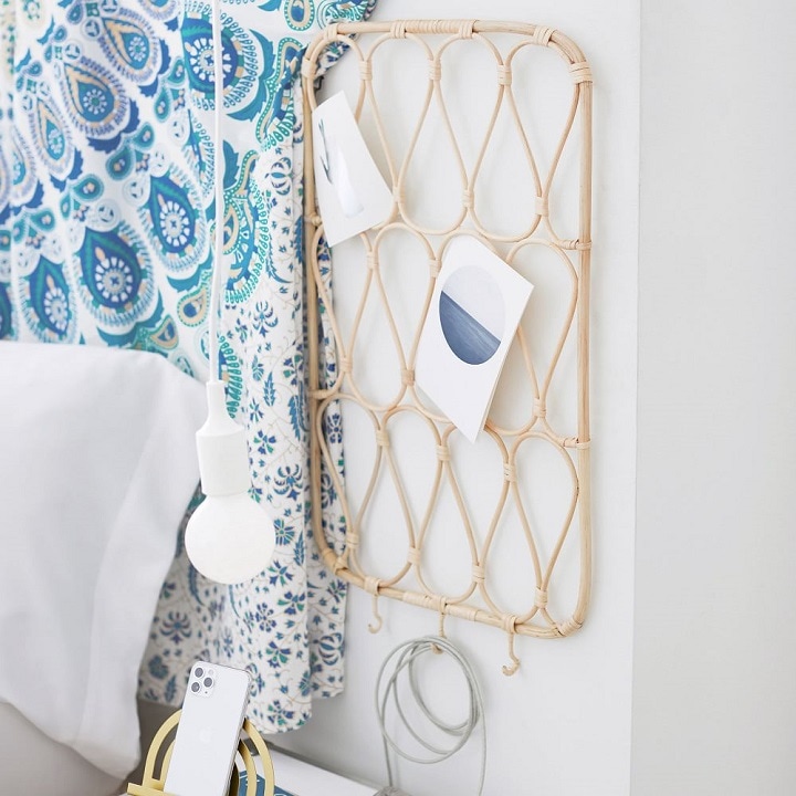 Rattan photo holder with hooks.