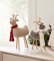 felted reindeer decorations on mantle