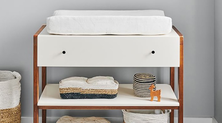 Modern changing table with shelving 