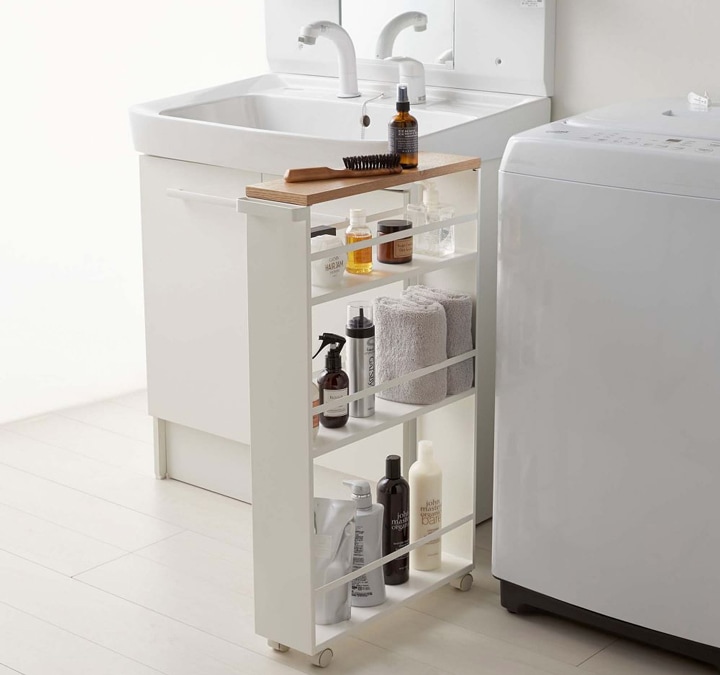 White and wood rolling cart in kitchen. 