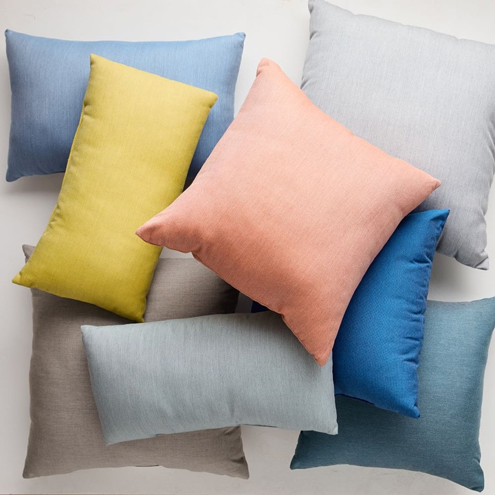 Solid indoor/outdoor pillows in various colors.