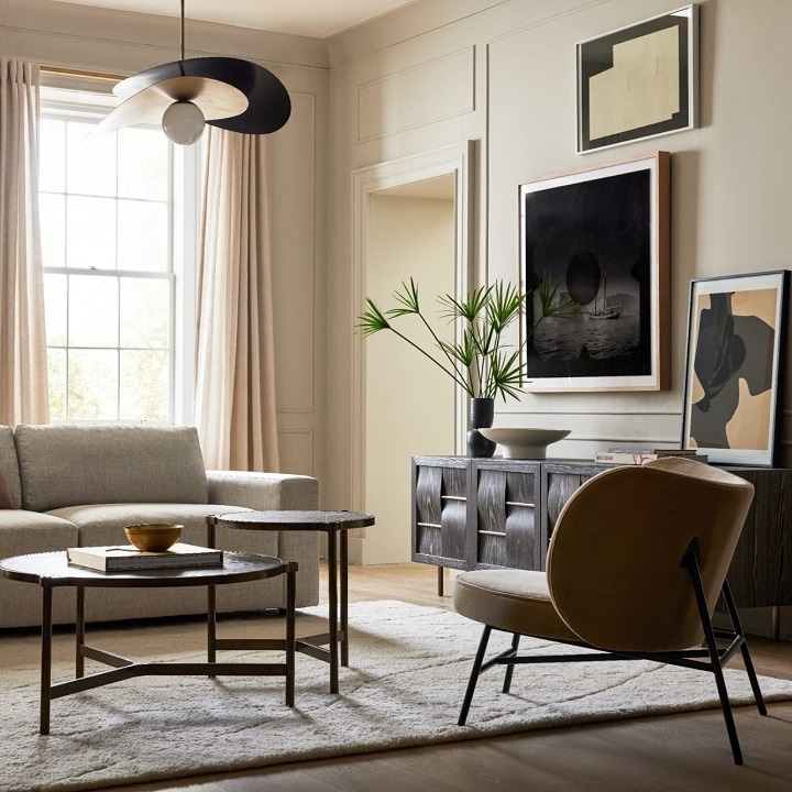 Modern living room with stylish seating next to credenza