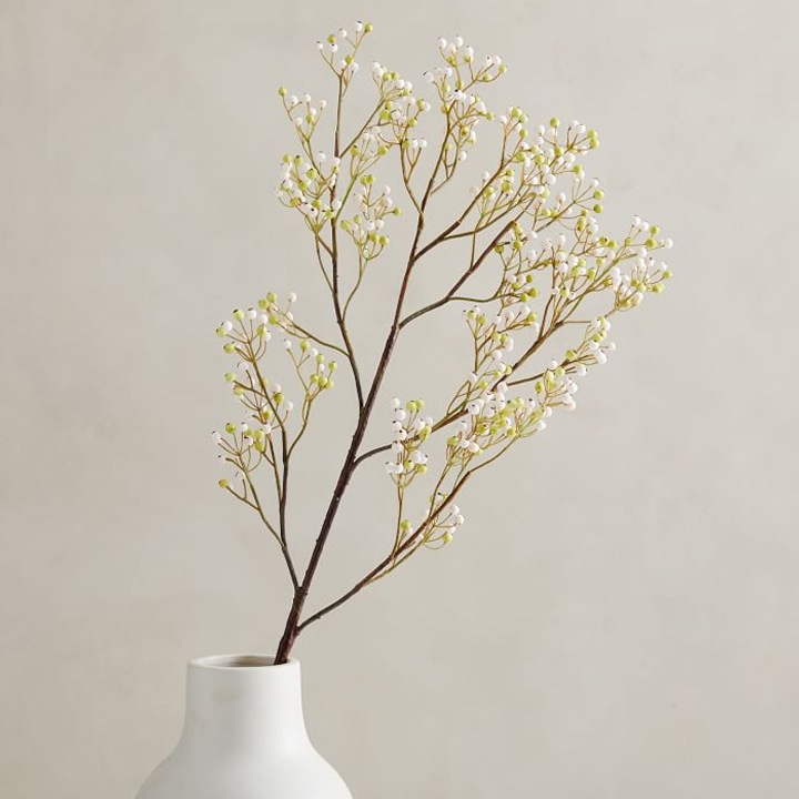 faux botanicals in a white vase