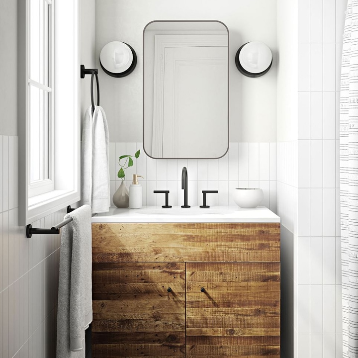 Small vanity made of reclaimed wood with black accents