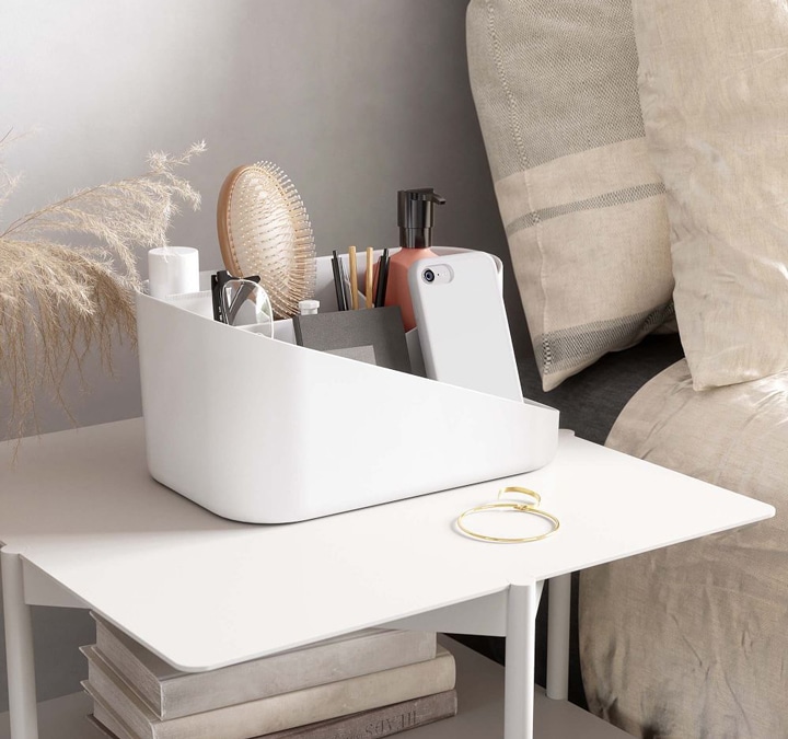 White bedside caddy on nightstand.