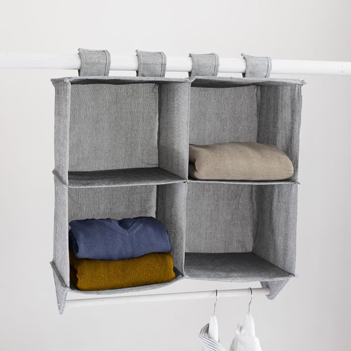 Hanging storage unit with sweaters