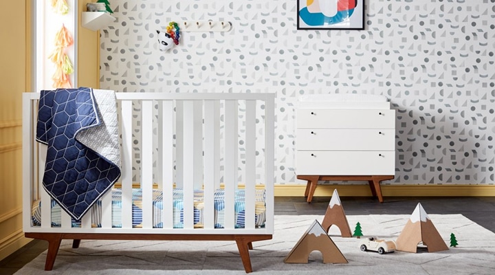 Nursery with patterned wallpaper