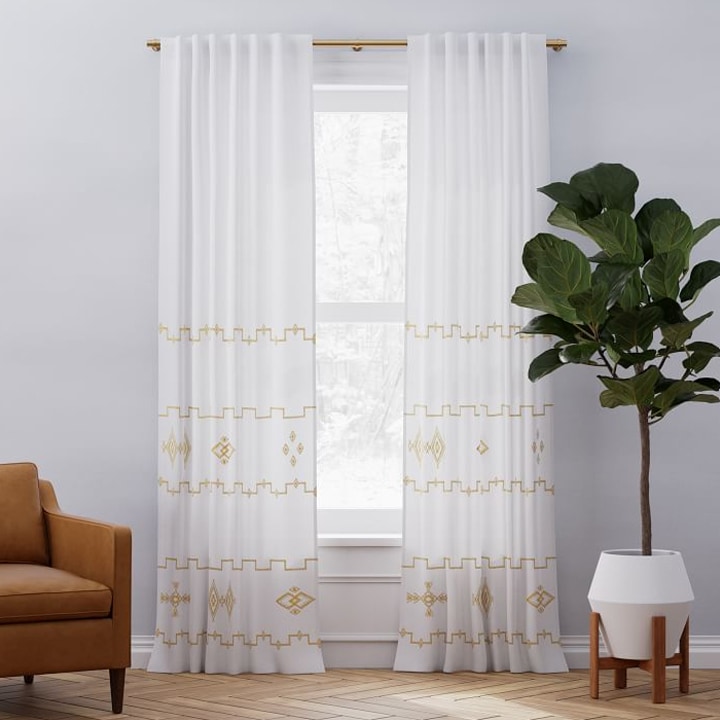white curtains with gold embroidery