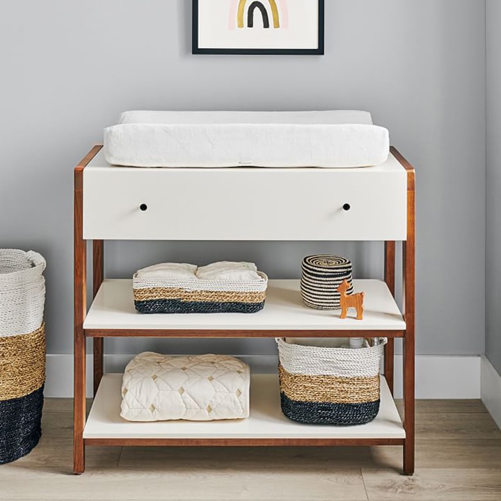 Modern baby changing table with baskets