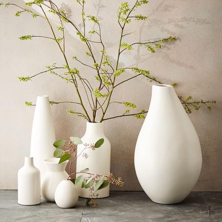 white vases with faux greenery