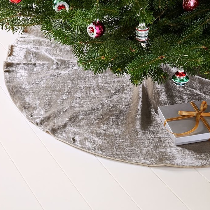 silver velvet christmas tree base with ornaments and present
