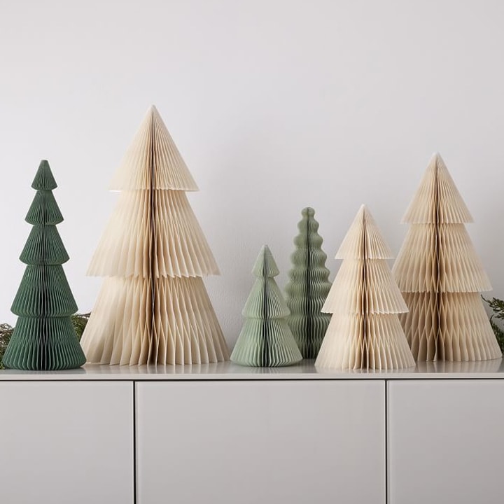 several accordion paper christmas trees