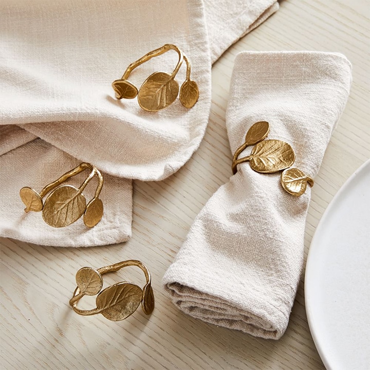 Gold leaves wrapped around cloth napkin.