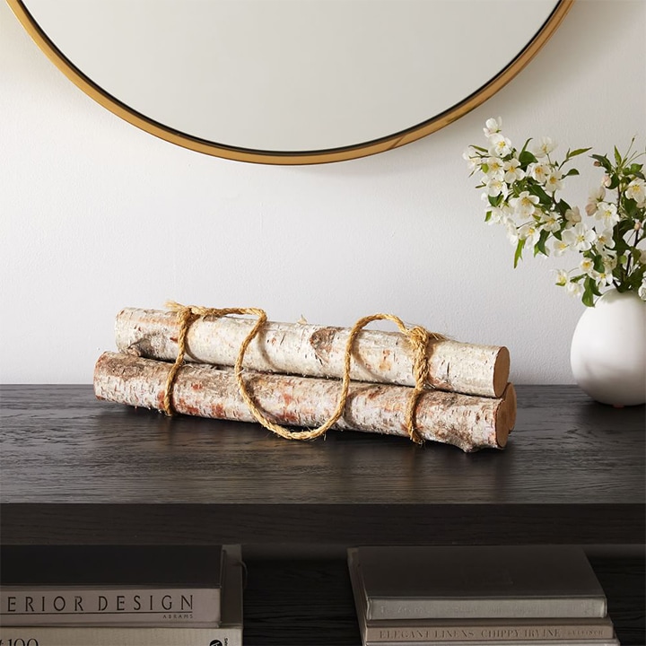 birch log bundles on table.