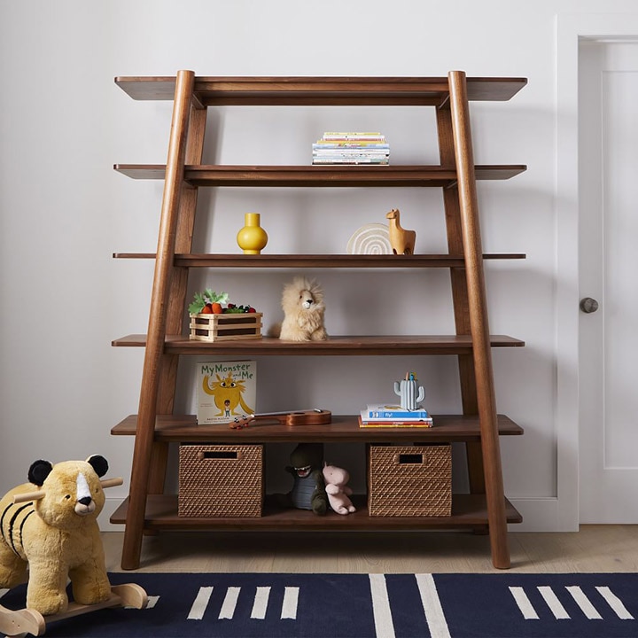 Angular bookshelf with various toys and books