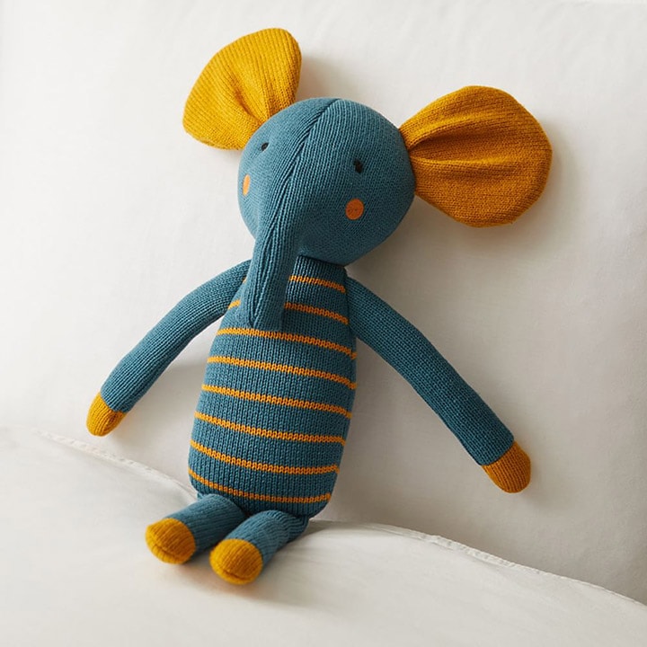 Blue and yellow stuffed elephant with stripes
