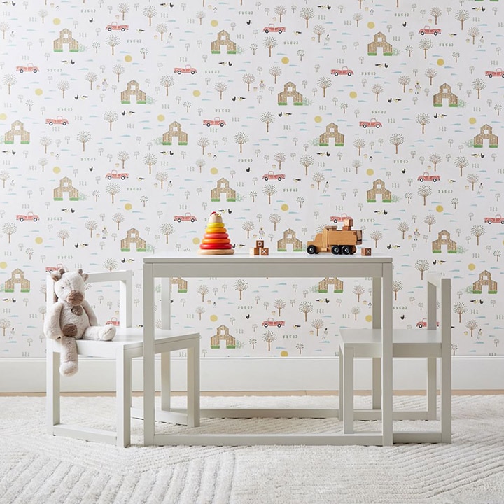 Children’s dining set in front of a wall with patterned wallpaper