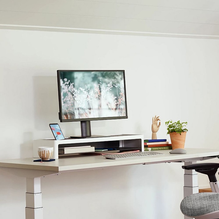 white standing desk with monitor stand