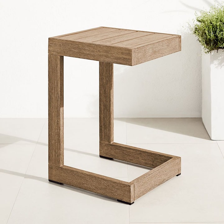 Wood side table shaped like the letter C. 