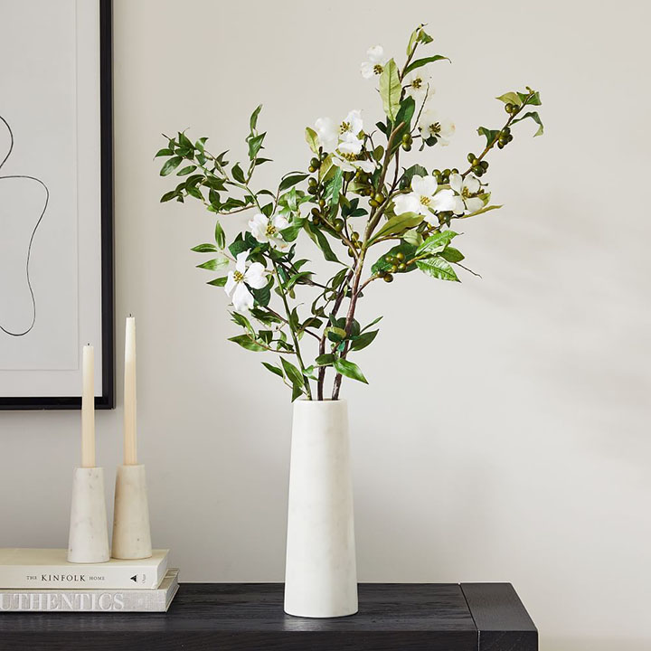 White vase with faux stems and branches 