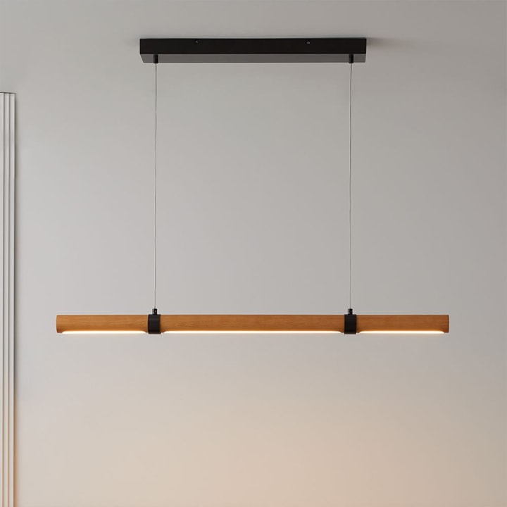 Linear wood LED bar pendant light hanging from ceiling.