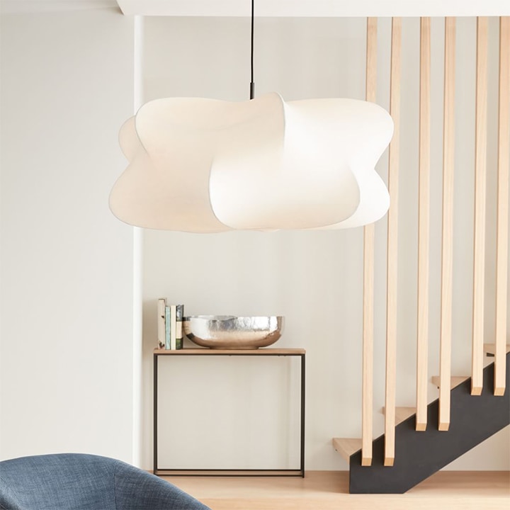 Cloud-shaped pendant light with black cord.