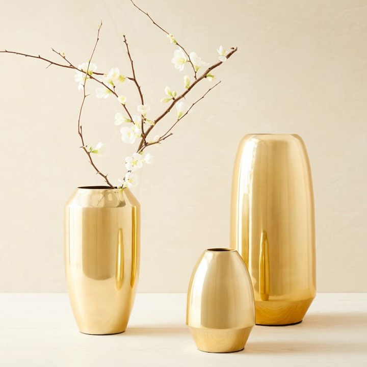 Assorted gold vases. 