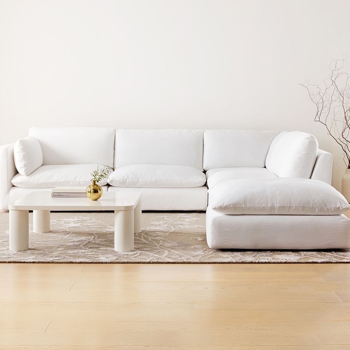White sofa, white coffee table and white walls.
