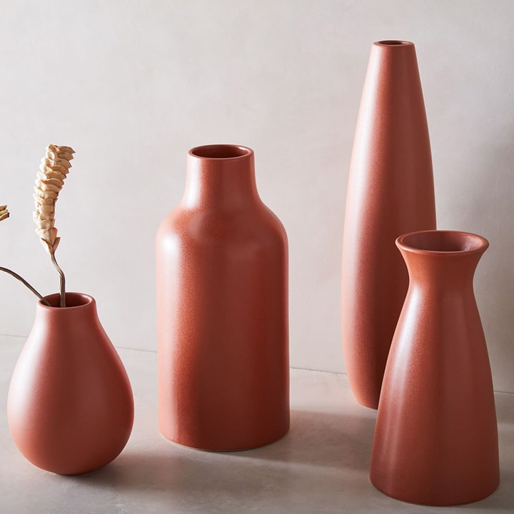 Assorted red vases.