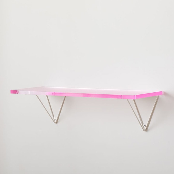 Pink acrylic shelving.