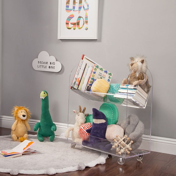 Play area with various stuffed animals and books
