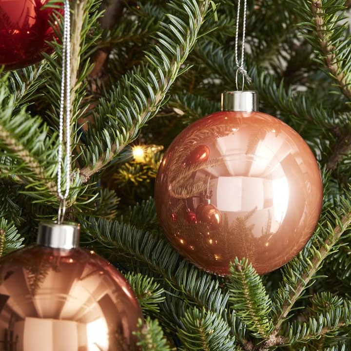 blush circular ornament on tree