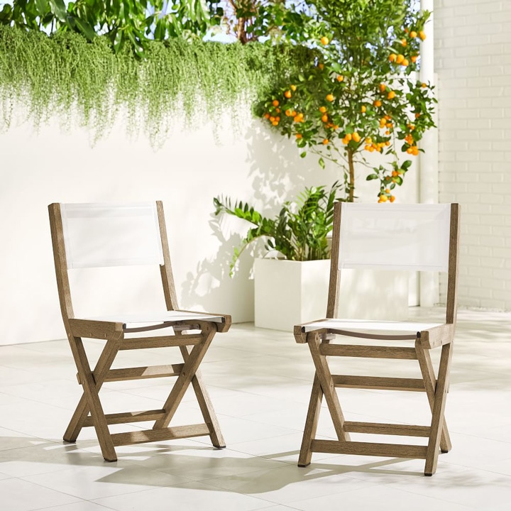 Folding outdoor chairs in white.