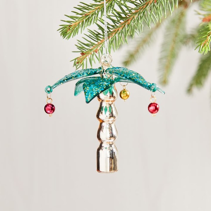 shiny sparkly palm tree ornament on christmas tree
