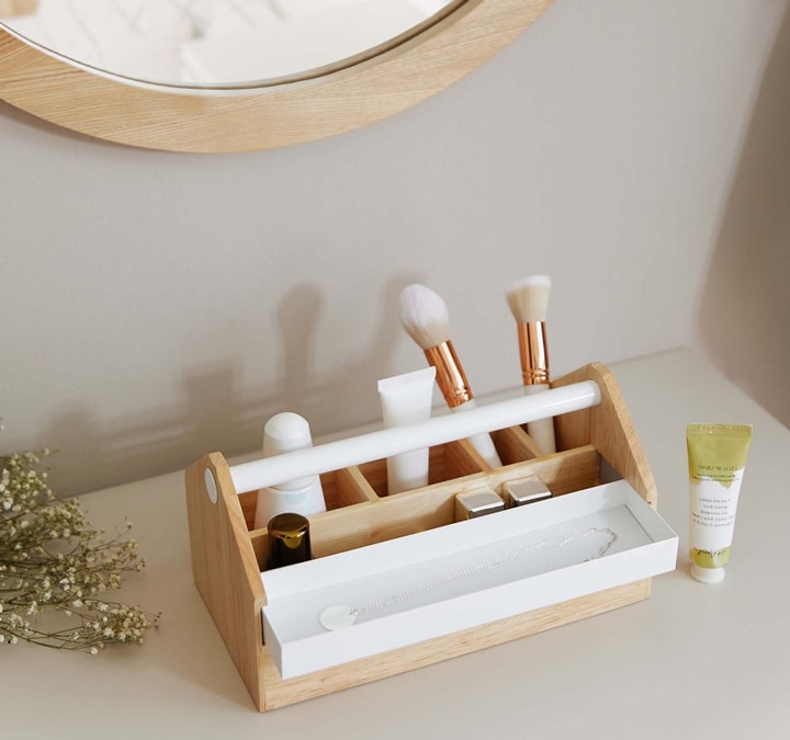 White and wood makeup organizer.