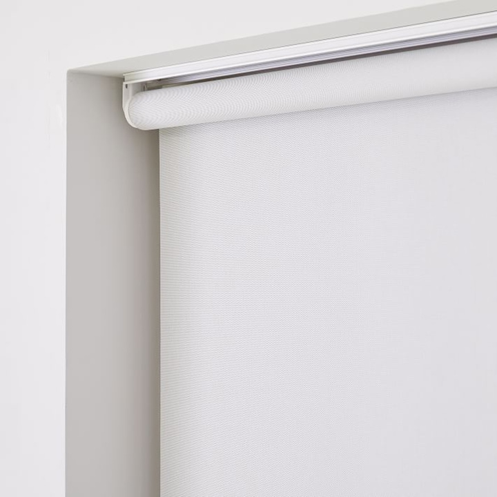Close up of white roller shade.