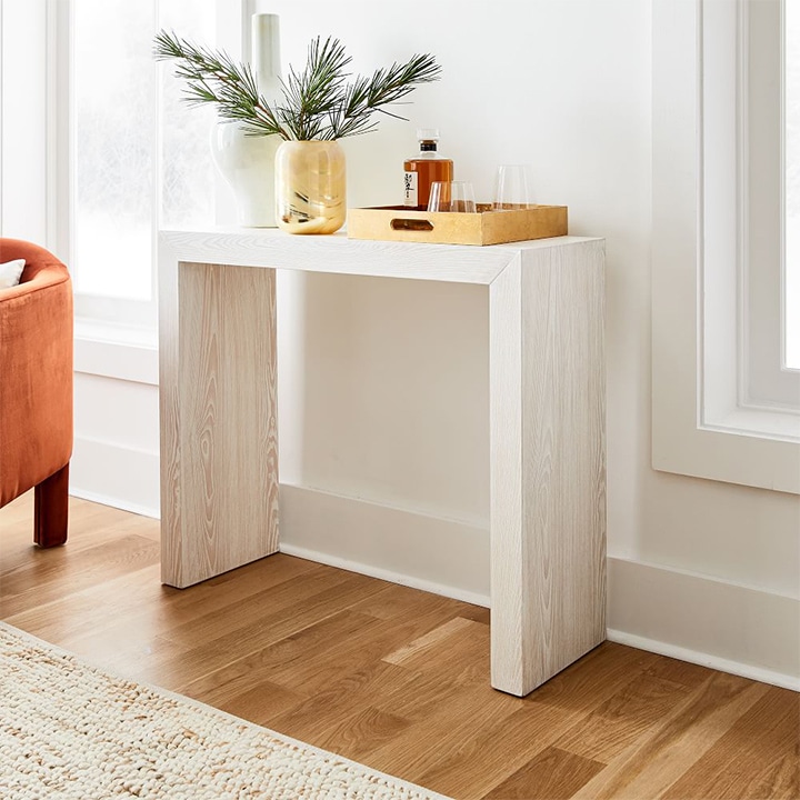 Whitewashed bridge entry console with waterfall sides